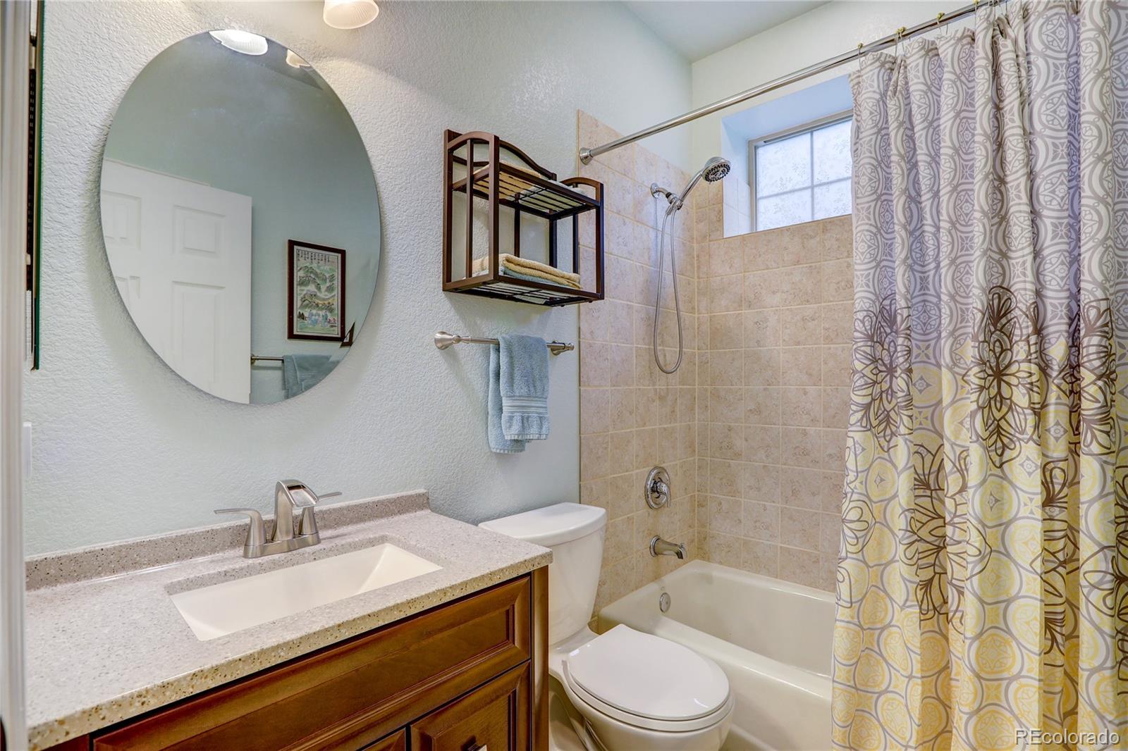 634 Foxtail Circle Black Hawk, CO 80422 - Photo 28 of 40 a bathroom with a sink toilet and shower