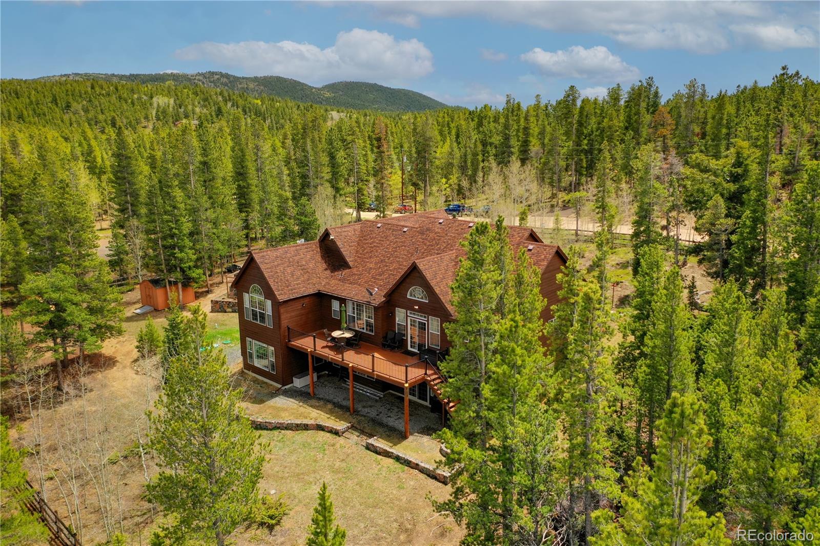 634 Foxtail Circle Black Hawk, CO 80422 - Photo 39 of 40 a view of a city with lush green forest