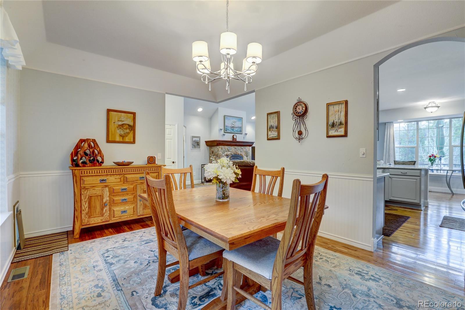 634 Foxtail Circle Black Hawk, CO 80422 - Photo 9 of 40 a view of a dining room with furniture and wooden floor