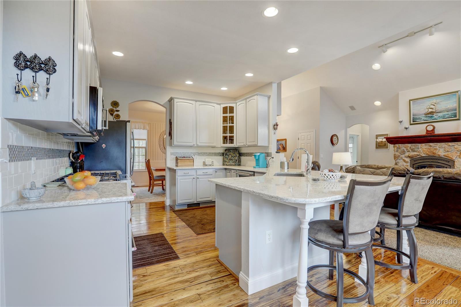 634 Foxtail Circle Black Hawk, CO 80422 - Photo 10 of 40 a kitchen that has a lot of cabinets in it and appliances