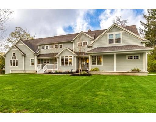 51 Hidden Road Andover, MA 01810 - Photo 1 of 30 a view of a white house with a big yard and potted plants