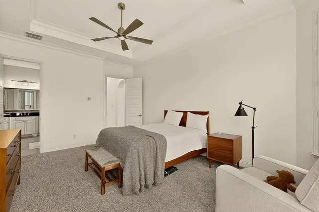 a bedroom with a bed and a television