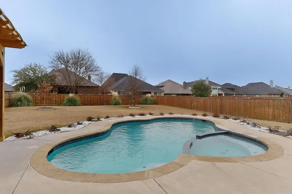 an aerial view of a house with outdoor space