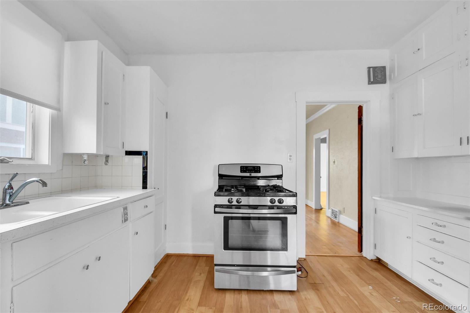 3159 West 36th Avenue Denver, CO 80211 - Photo 14 of 33 a kitchen with cabinets and appliances