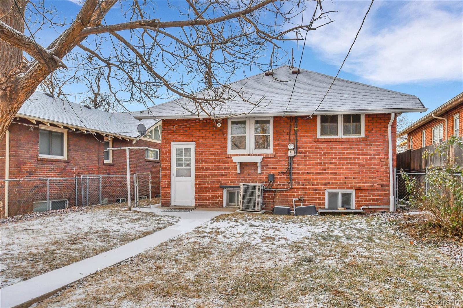 3159 West 36th Avenue Denver, CO 80211 - Photo 30 of 33 a front view of a house with a yard and garage