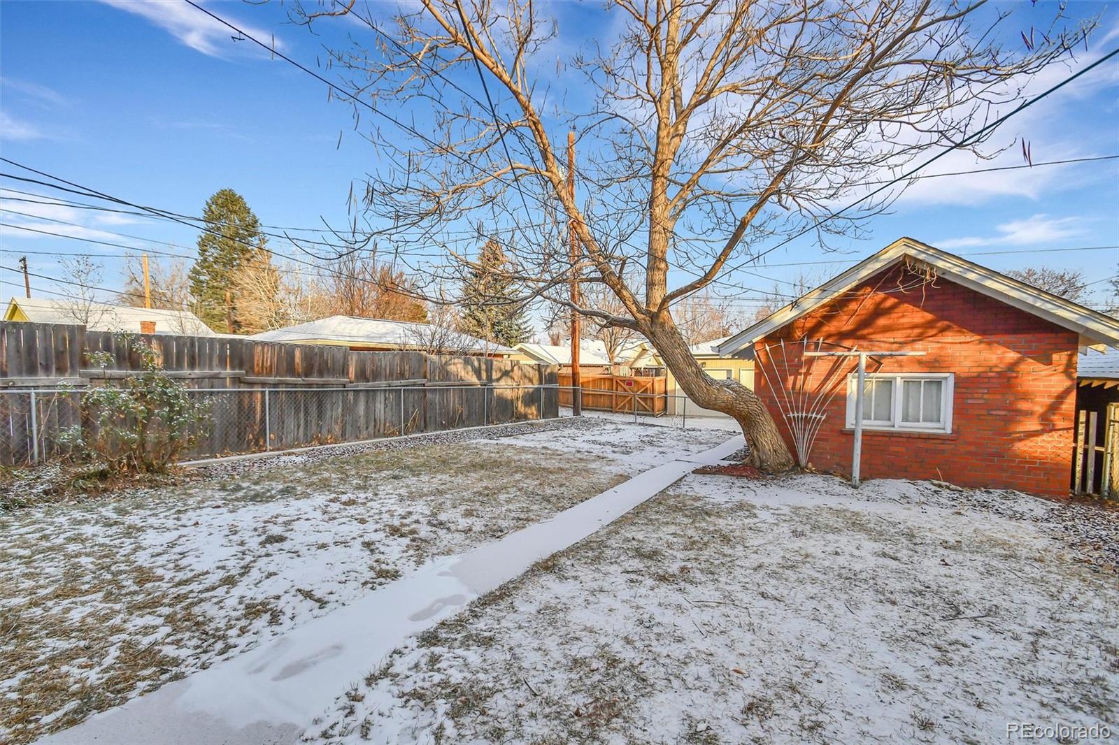 3159 West 36th Avenue Denver, CO 80211 - Photo 31 of 33 a backyard of a house with large trees