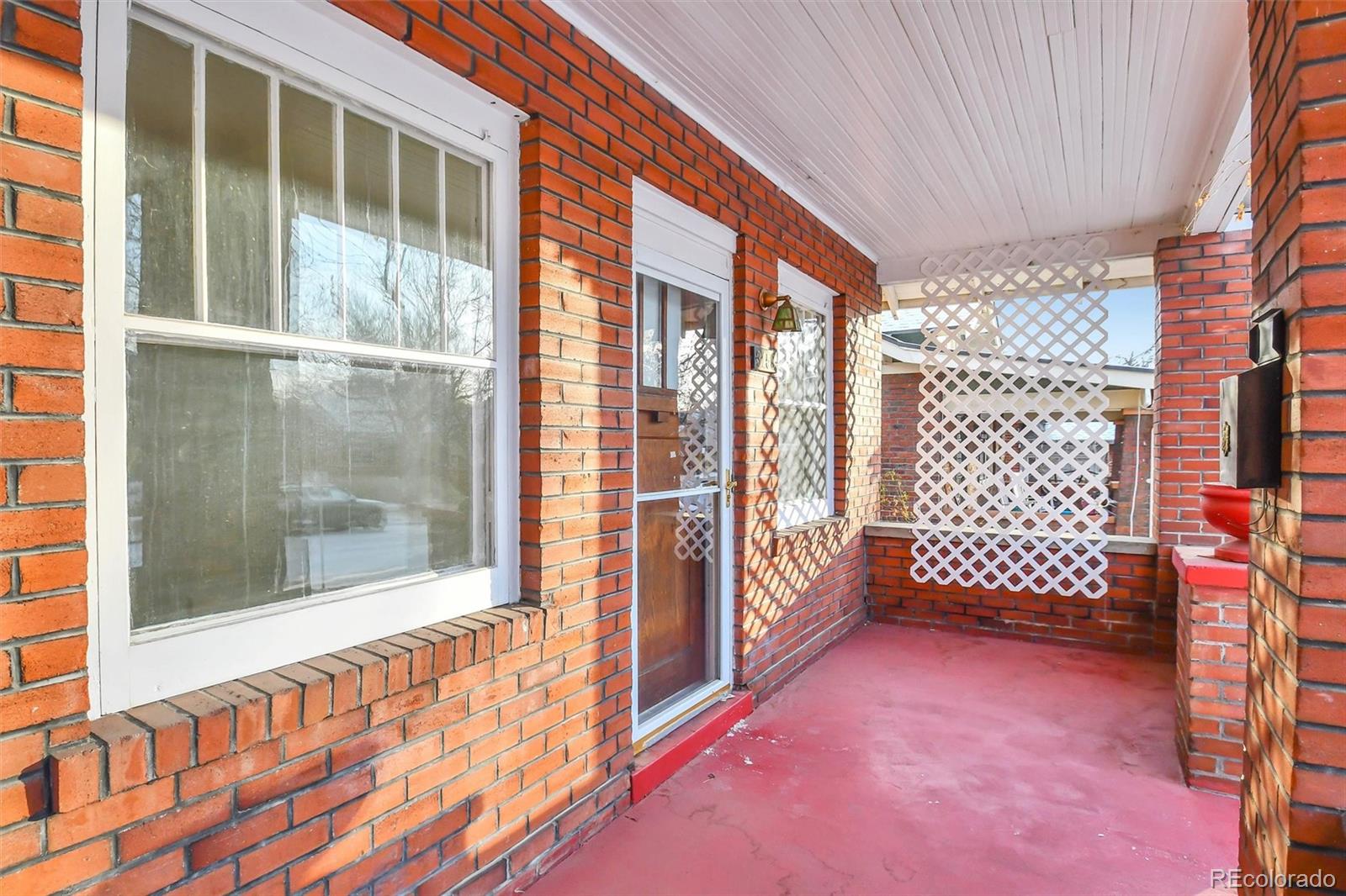 3159 West 36th Avenue Denver, CO 80211 - Photo 5 of 33 a view of a porch with a black gate