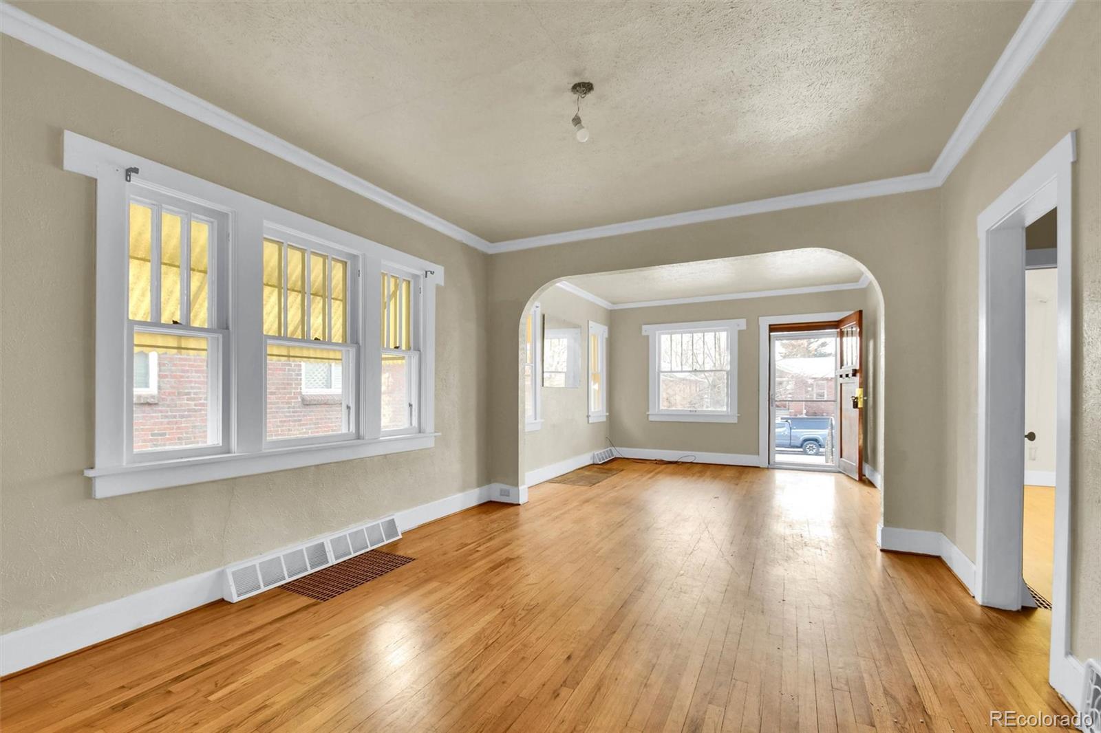 3159 West 36th Avenue Denver, CO 80211 - Photo 10 of 33 a view of an empty room with wooden floor and a window