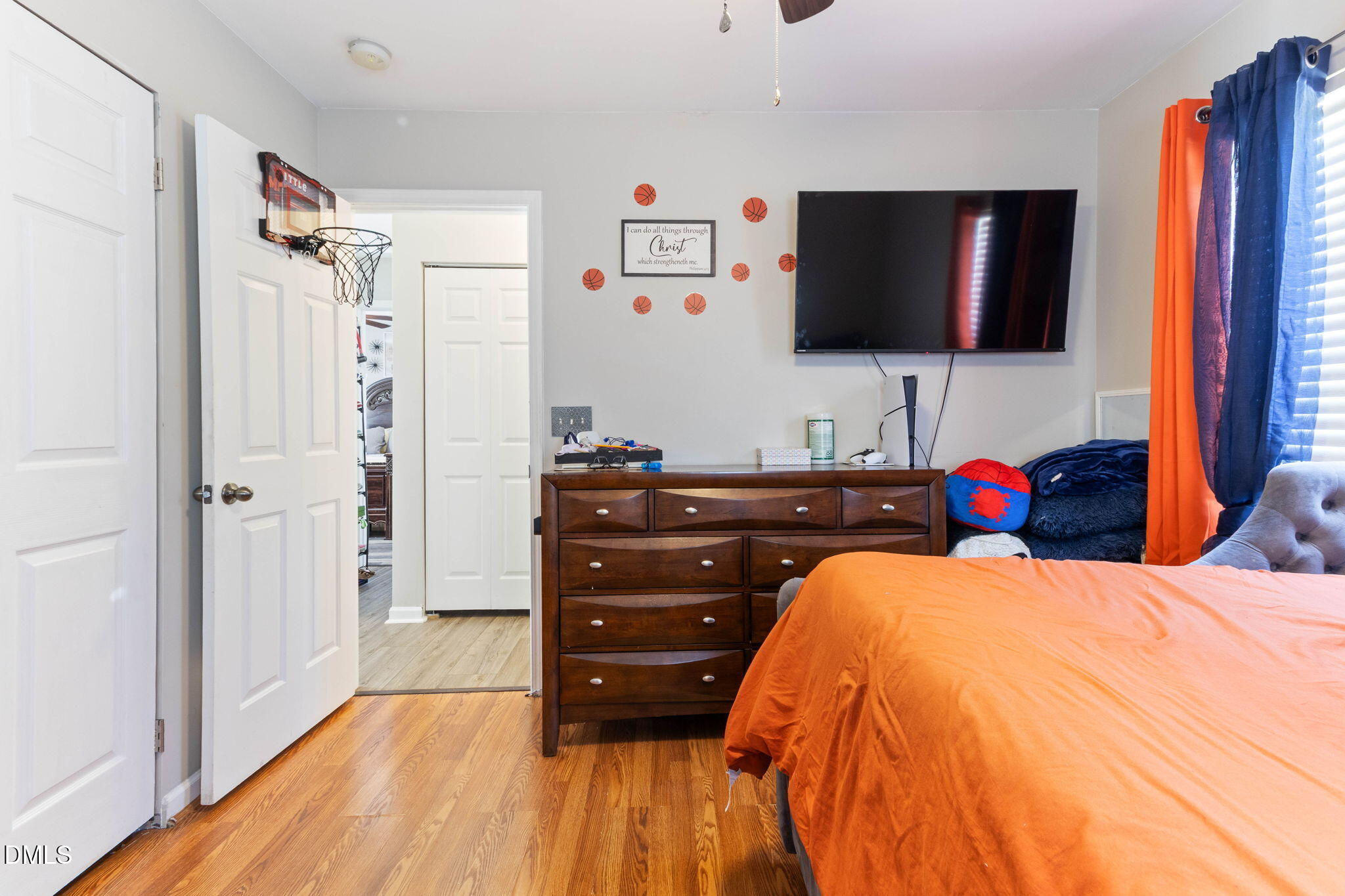 3713 Marshlane Way Raleigh, NC 27610 - Photo 26 of 38 a bedroom with a bed and a flat screen tv