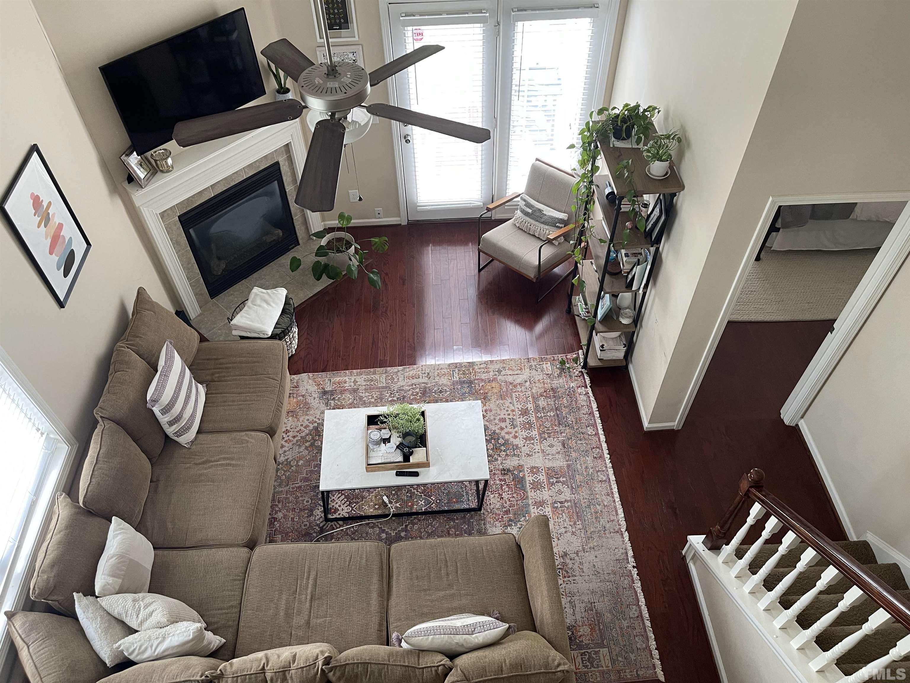 4711 Altha Street Raleigh, NC 27606 - Photo 13 of 25 a living room with furniture and a flat screen tv