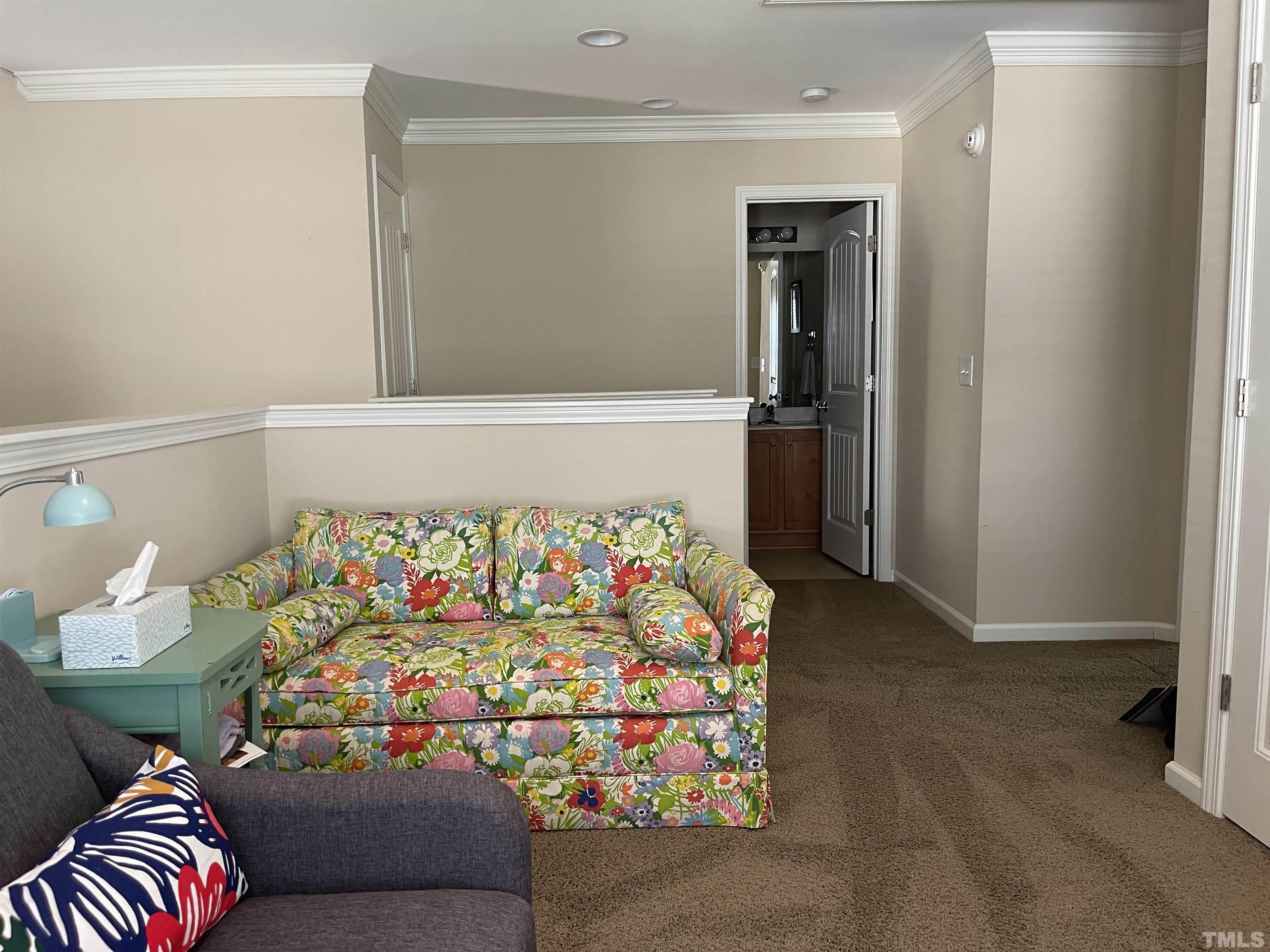 4711 Altha Street Raleigh, NC 27606 - Photo 21 of 25 a bedroom with a bed and a couch