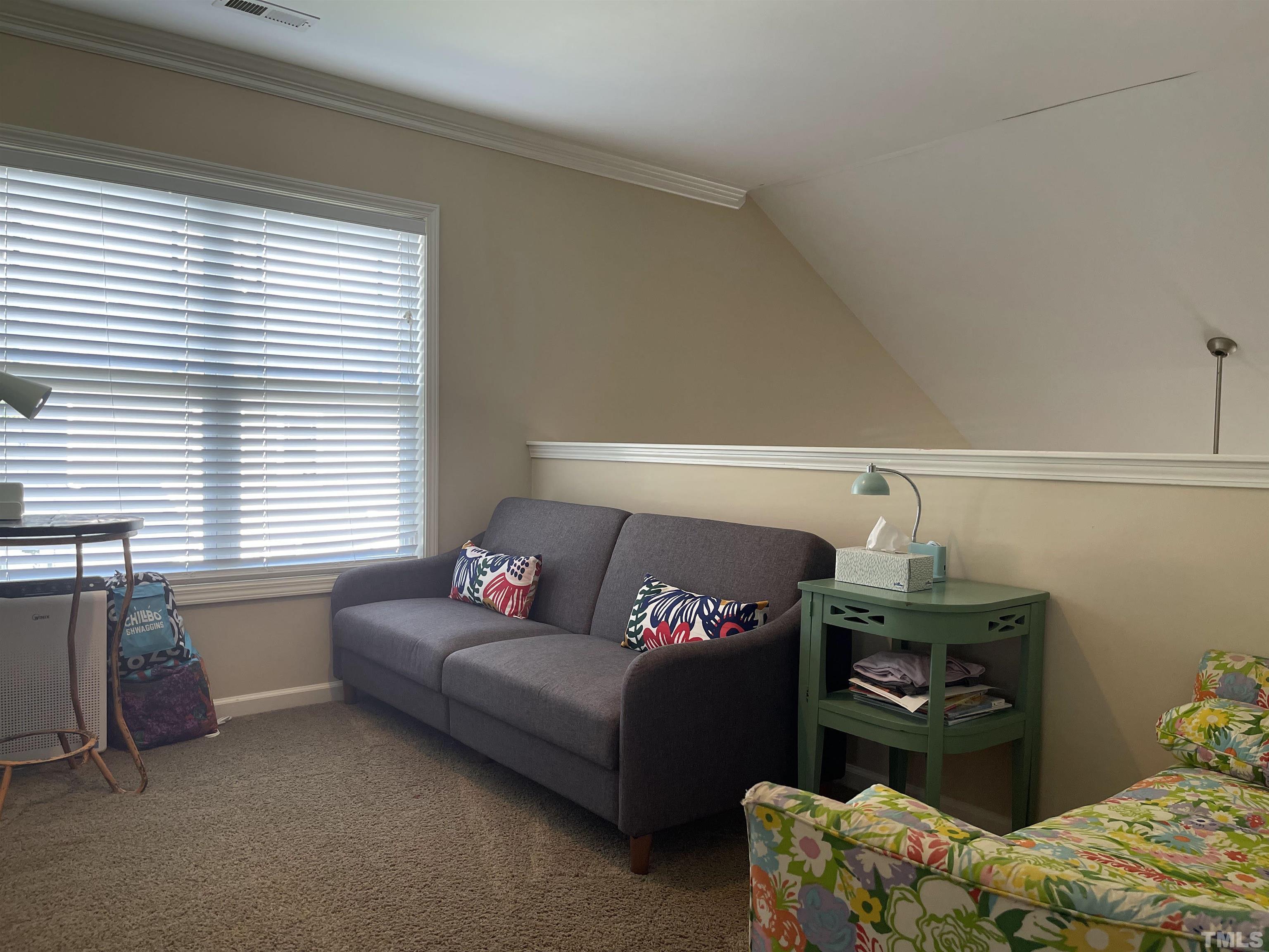 4711 Altha Street Raleigh, NC 27606 - Photo 22 of 25 a living room with furniture and a window