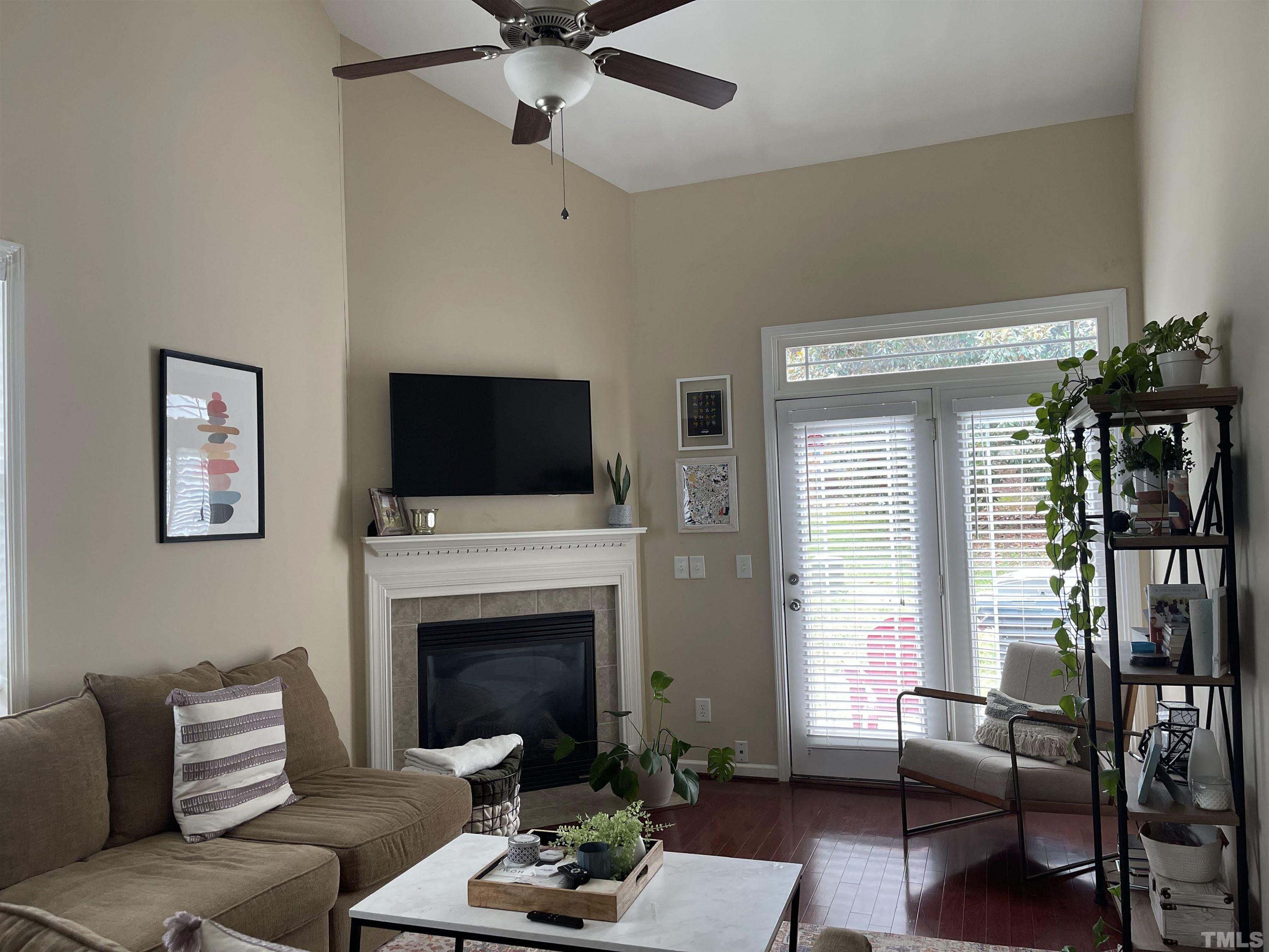 4711 Altha Street Raleigh, NC 27606 - Photo 9 of 25 a living room with furniture fireplace and flat screen tv