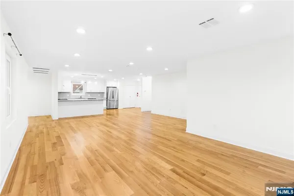 a view of kitchen with wooden floor