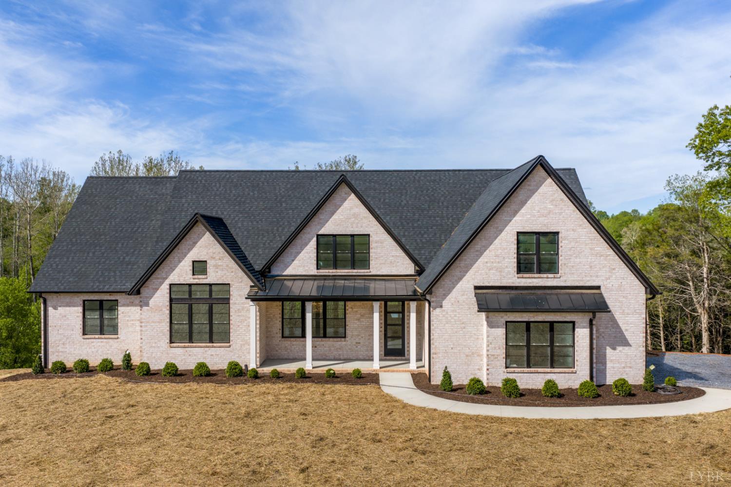 a front view of a house with a yard