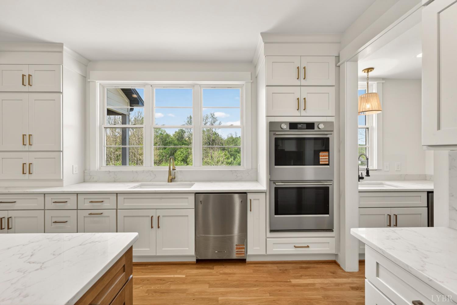 1488 Deer Hollow Road Forest, VA 24551 - Photo 11 of 68 a kitchen with stainless steel appliances kitchen island granite countertop a stove a sink and a microwave