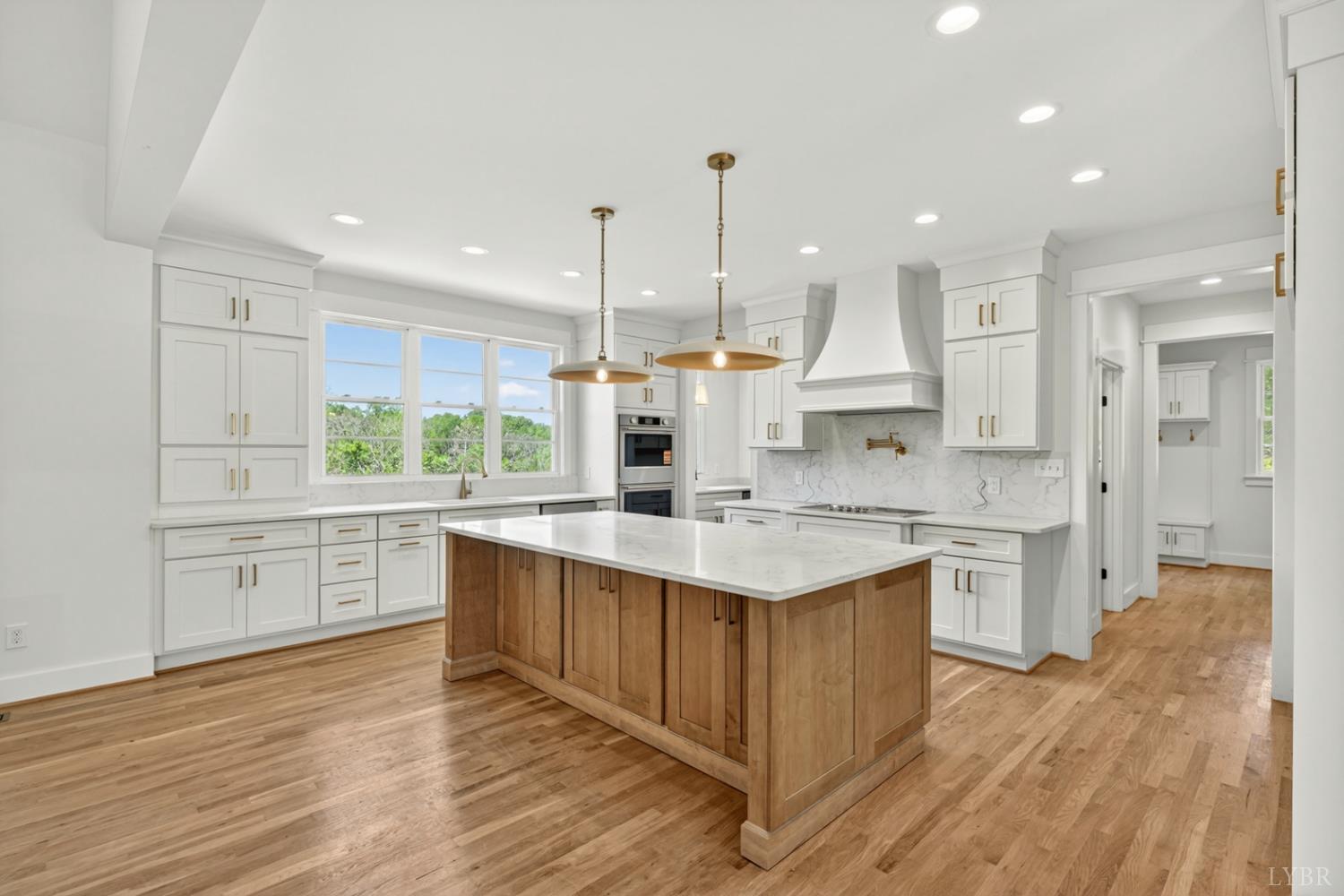 1488 Deer Hollow Road Forest, VA 24551 - Photo 16 of 68 a kitchen with a sink stove cabinets and refrigerator
