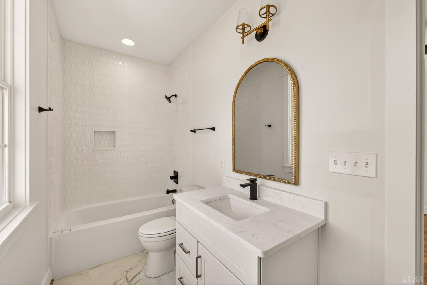 1488 Deer Hollow Road Forest, VA 24551 - Photo 34 of 68 a bathroom with a sink a toilet and shower
