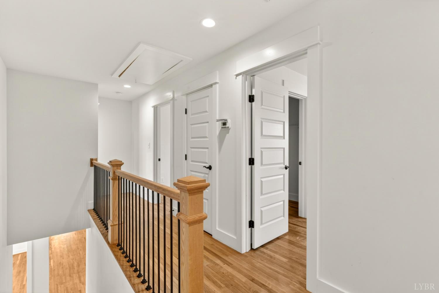 1488 Deer Hollow Road Forest, VA 24551 - Photo 35 of 68 a view of a hallway with wooden floor and staircase