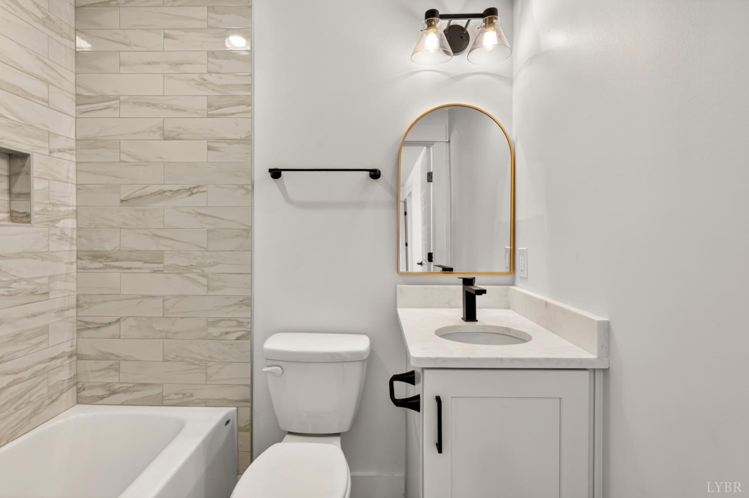 1488 Deer Hollow Road Forest, VA 24551 - Photo 48 of 68 a bathroom with a sink a toilet and a mirror
