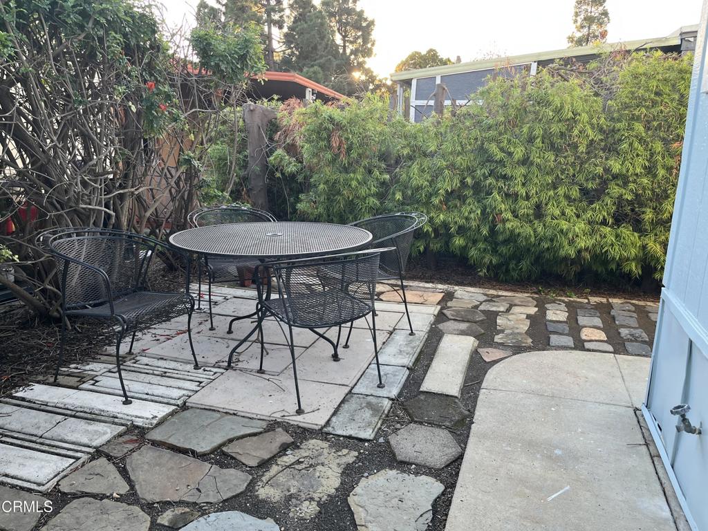 103 Gay Drive, Unit 103 Ventura, CA 93003 - Photo 17 of 17 a view of a table and chairs in the patio