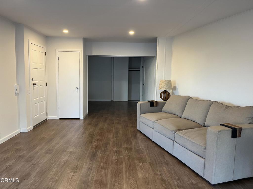 103 Gay Drive, Unit 103 Ventura, CA 93003 - Photo 3 of 17 a living room with furniture and wooden floor