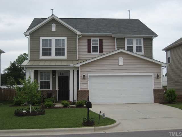 148 Solheim Lane Raleigh, NC 27603 - Photo 1 of 12 a front view of a house with garden