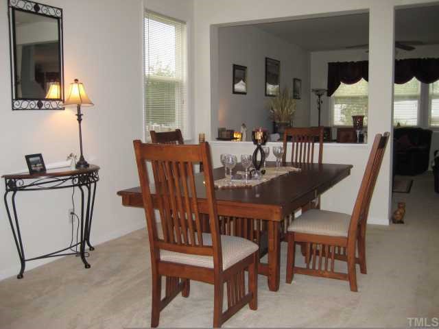 148 Solheim Lane Raleigh, NC 27603 - Photo 2 of 12 a view of a dining room with furniture