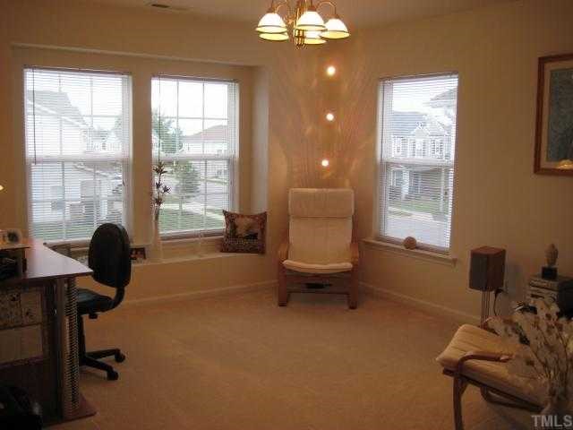 148 Solheim Lane Raleigh, NC 27603 - Photo 9 of 12 a living room with furniture and a window