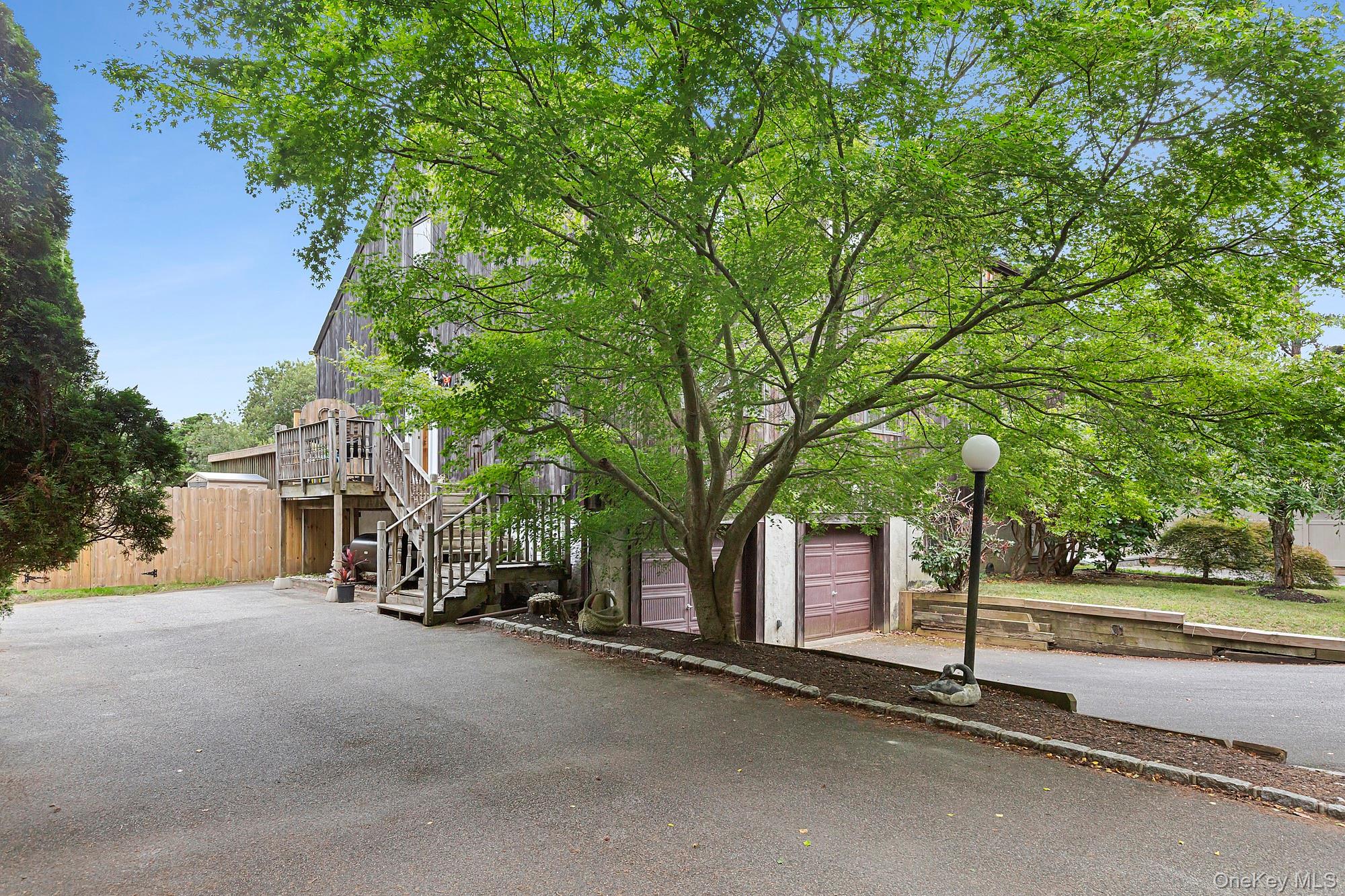 624 Noyack Road Southampton, NY 11968 - Photo 15 of 15 a view of a street with a car park side of the road