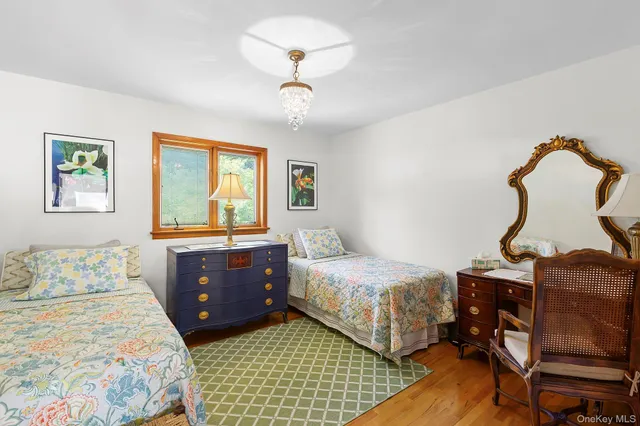 a bedroom with double bed and window