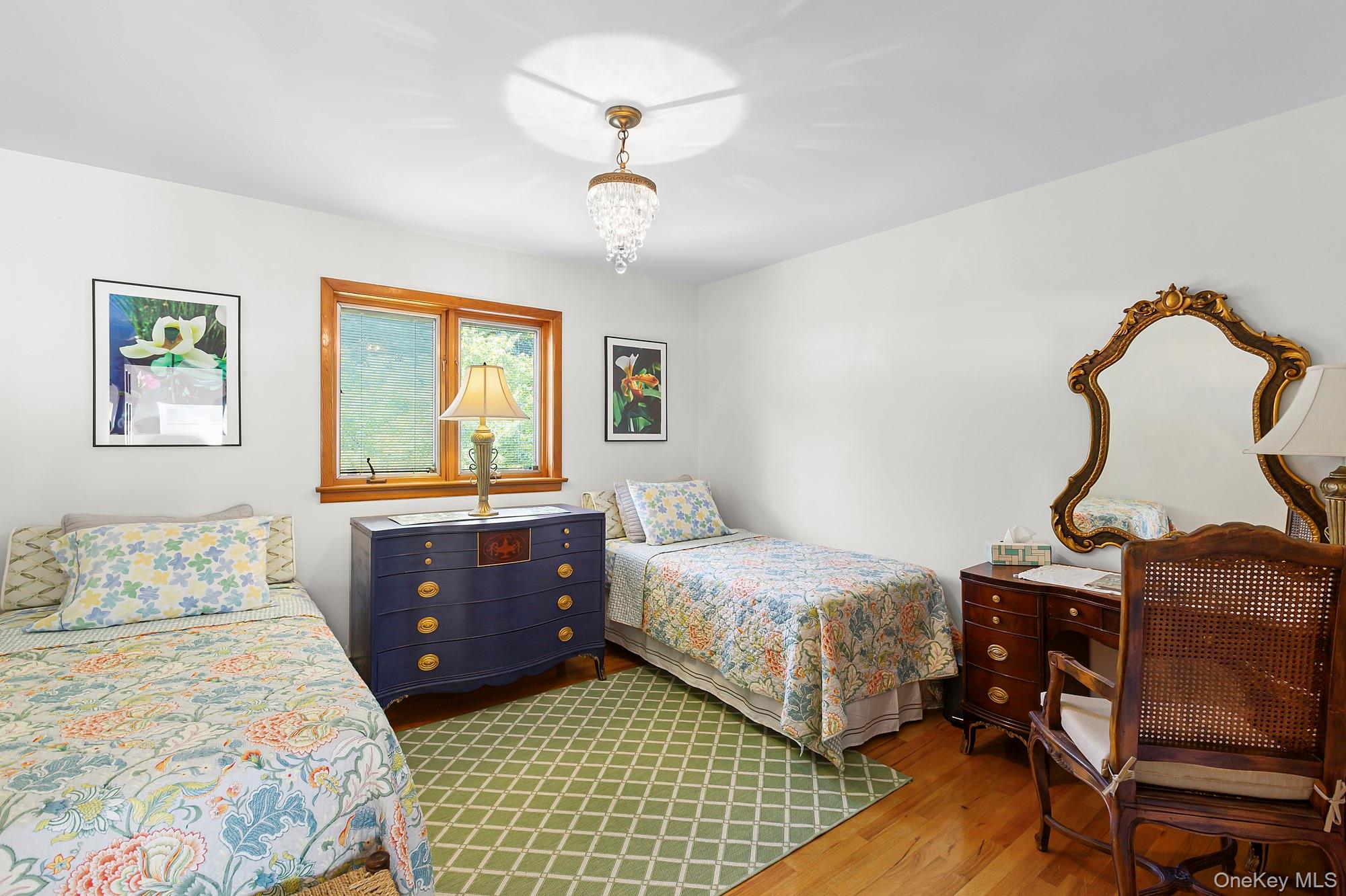 624 Noyack Road Southampton, NY 11968 - Photo 7 of 15 a bedroom with double bed and window