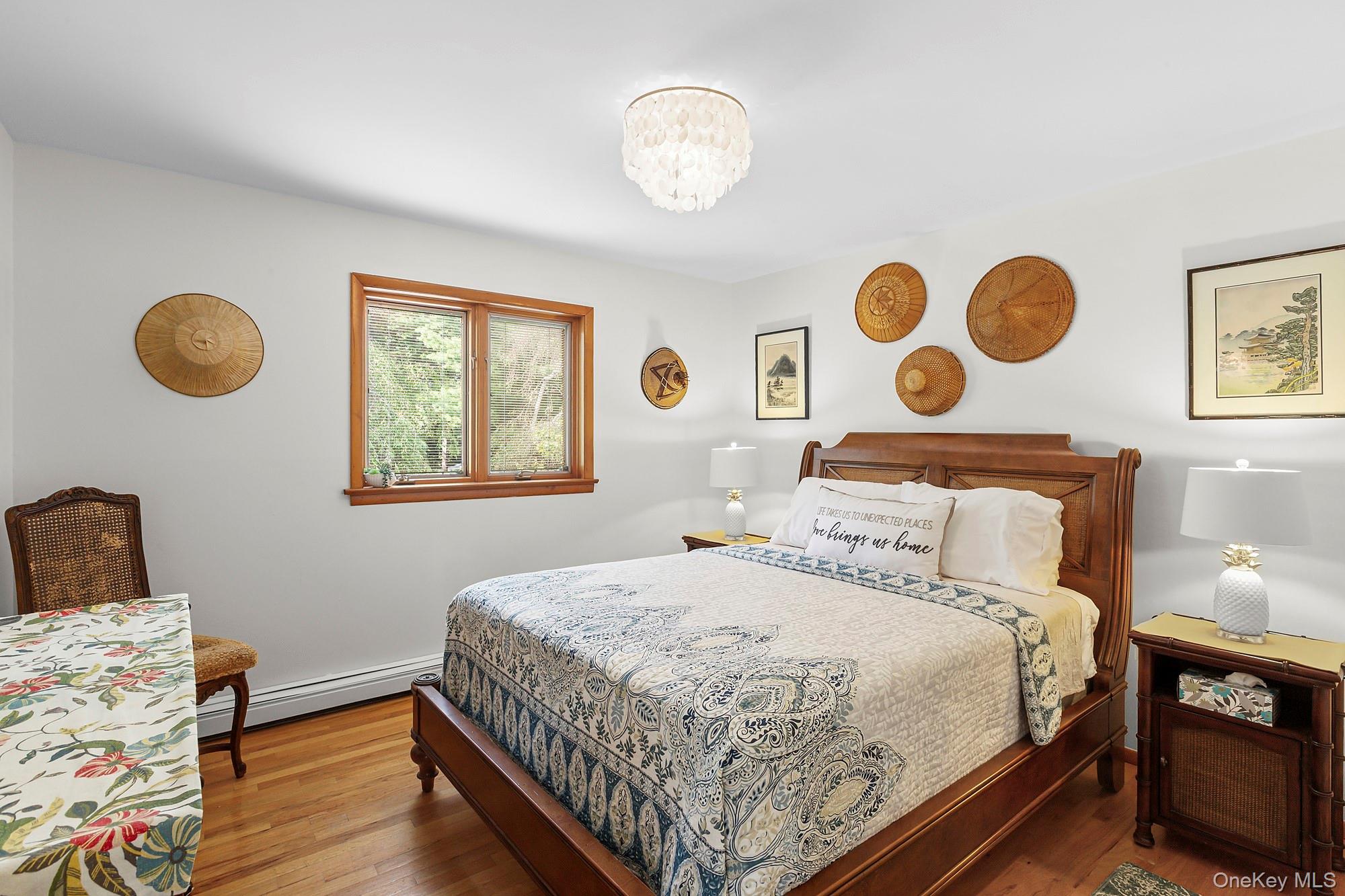 624 Noyack Road Southampton, NY 11968 - Photo 9 of 15 a bedroom with a bed and a window