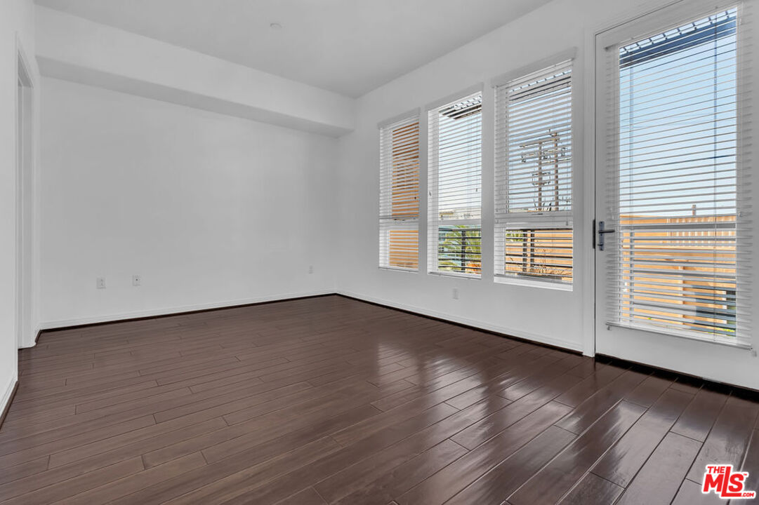 4050 Glencoe Avenue, Unit 405 Marina del Rey, CA 90292 - Photo 12 of 42 wooden floor in an empty room with a window