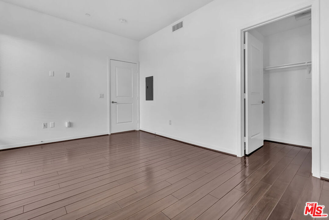 4050 Glencoe Avenue, Unit 405 Marina del Rey, CA 90292 - Photo 13 of 42 a view of an empty room with wooden floor