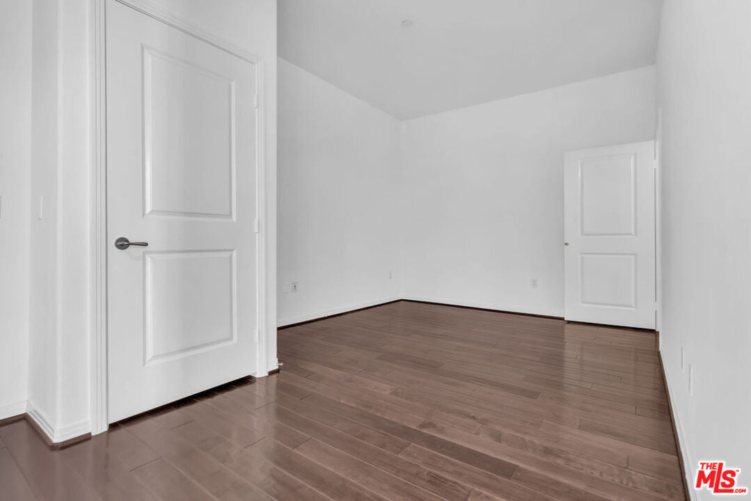 4050 Glencoe Avenue, Unit 405 Marina del Rey, CA 90292 - Photo 16 of 42 a view of an empty room with wooden floor