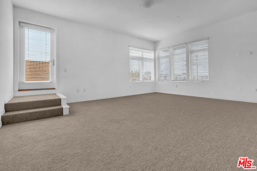 4050 Glencoe Avenue, Unit 405 Marina del Rey, CA 90292 - Photo 23 of 42 an empty room with windows