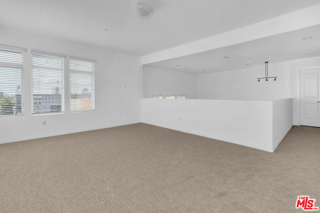 4050 Glencoe Avenue, Unit 405 Marina del Rey, CA 90292 - Photo 24 of 42 a view of an empty room with a window