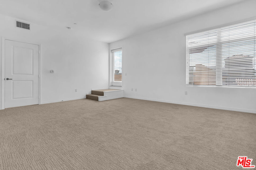 4050 Glencoe Avenue, Unit 405 Marina del Rey, CA 90292 - Photo 25 of 42 a view of an empty room with a window