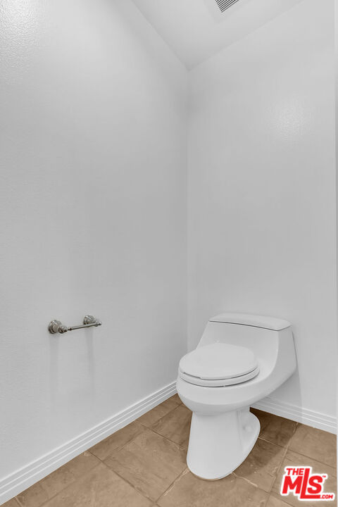 4050 Glencoe Avenue, Unit 405 Marina del Rey, CA 90292 - Photo 30 of 42 a white toilet sitting next to a white wall
