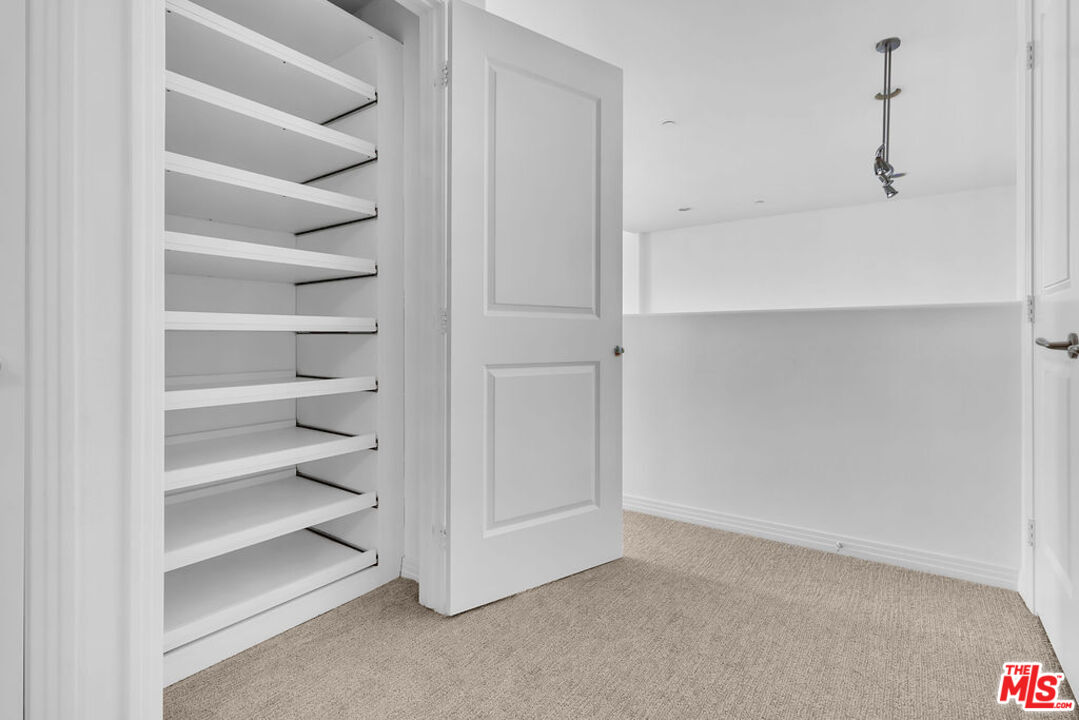 4050 Glencoe Avenue, Unit 405 Marina del Rey, CA 90292 - Photo 31 of 42 a view of walk in closet with empty racks