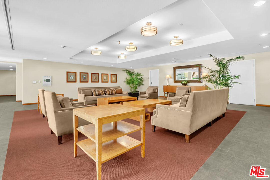 4050 Glencoe Avenue, Unit 405 Marina del Rey, CA 90292 - Photo 36 of 42 a living room with furniture and a large window