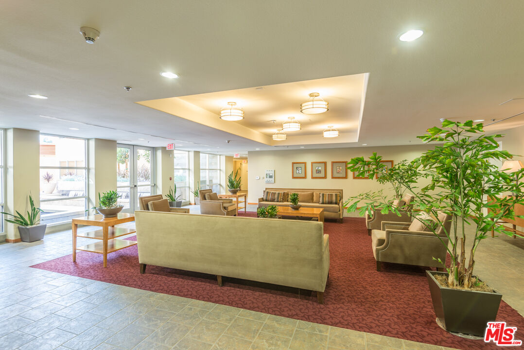 4050 Glencoe Avenue, Unit 405 Marina del Rey, CA 90292 - Photo 37 of 42 a living room with furniture and a large window