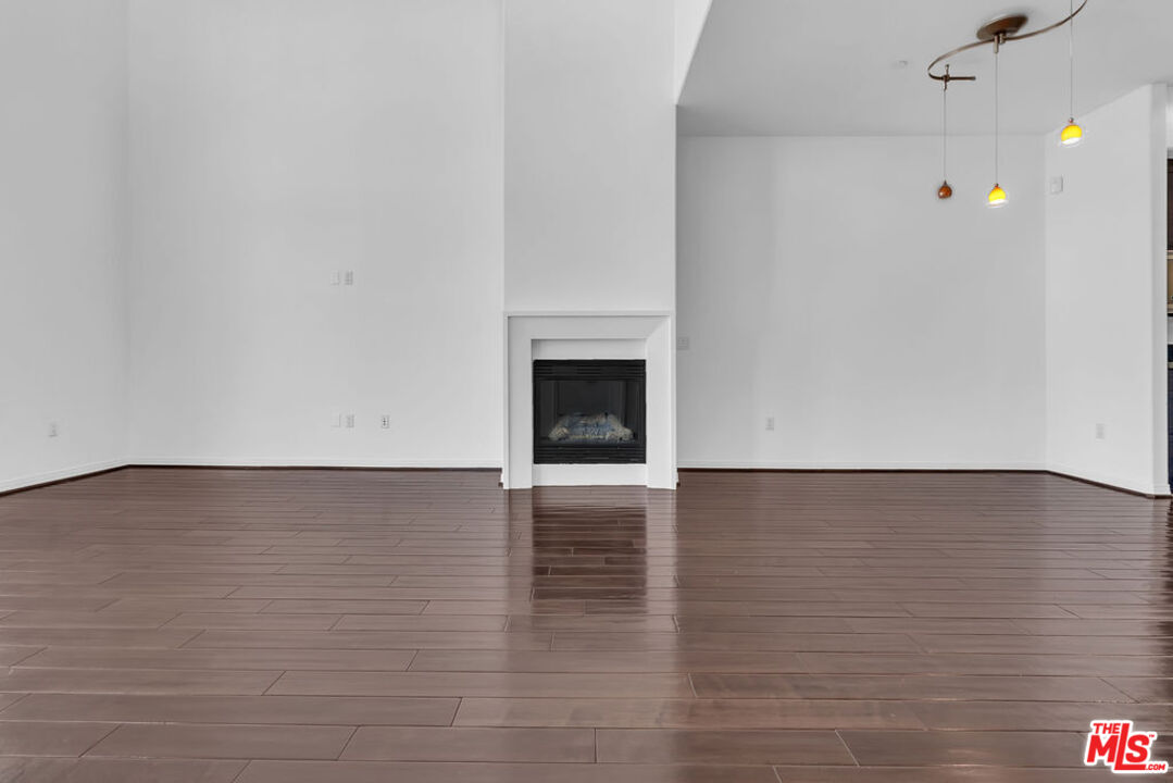 4050 Glencoe Avenue, Unit 405 Marina del Rey, CA 90292 - Photo 4 of 42 a view of an empty room and wooden floor