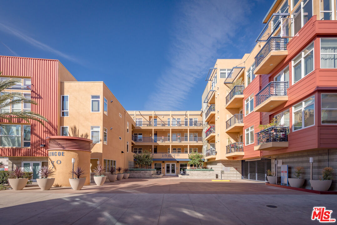 4050 Glencoe Avenue, Unit 405 Marina del Rey, CA 90292 - Photo 42 of 42 a city street lined with tall buildings and a street