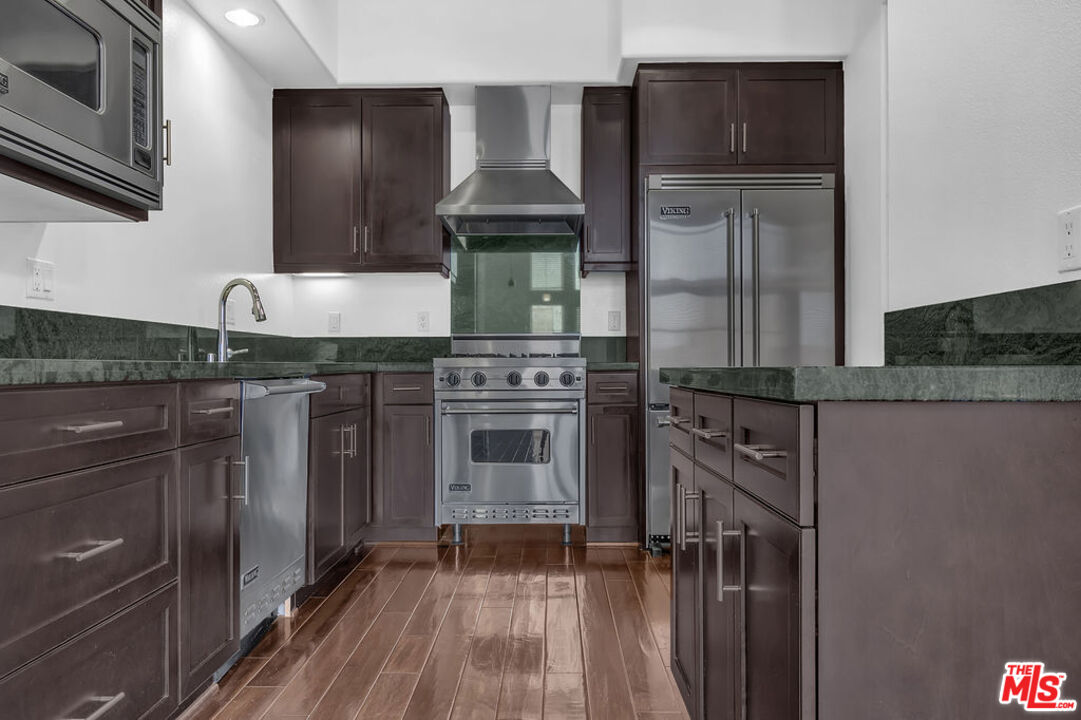 4050 Glencoe Avenue, Unit 405 Marina del Rey, CA 90292 - Photo 6 of 42 a kitchen with granite countertop a stove and a sink