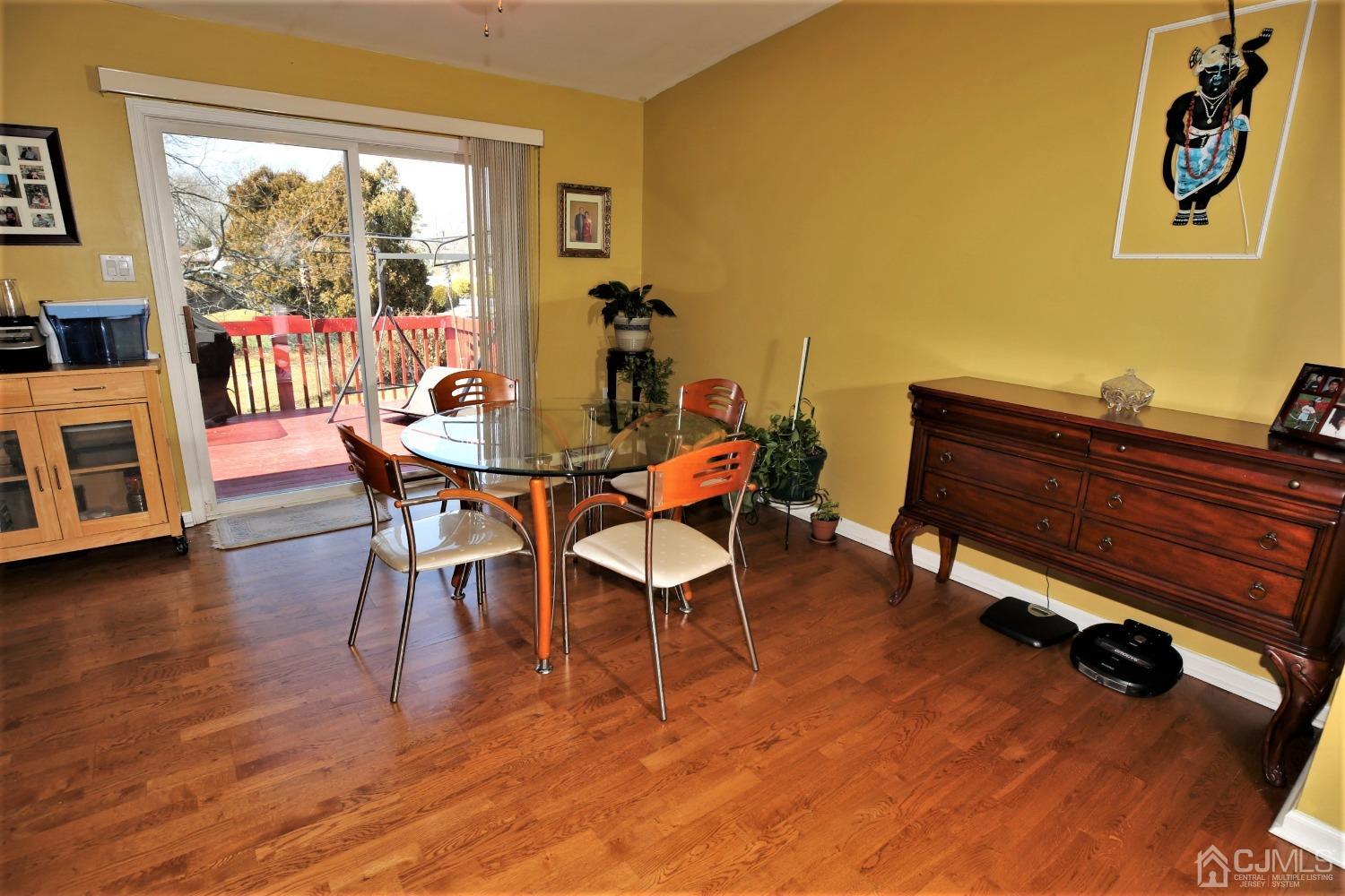 148 Kendall Road Kendall Park, NJ 08824 - Photo 20 of 47 a dining room with furniture and wooden floor