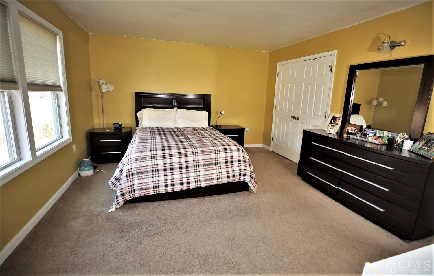 148 Kendall Road Kendall Park, NJ 08824 - Photo 31 of 47 a bedroom with a bed and window