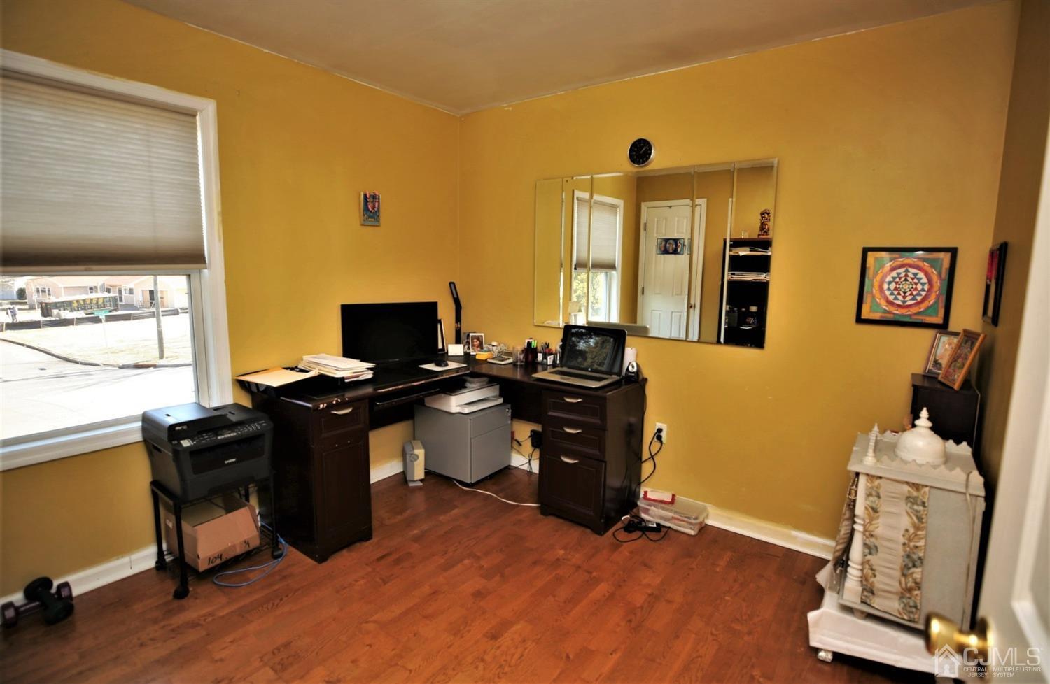 148 Kendall Road Kendall Park, NJ 08824 - Photo 36 of 47 a view of a workspace with furniture and a window