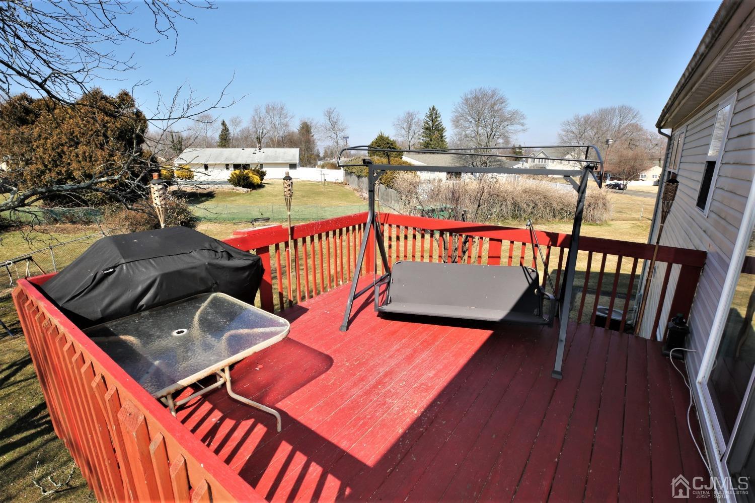148 Kendall Road Kendall Park, NJ 08824 - Photo 46 of 47 a terrace with outdoor seating and wooden floor